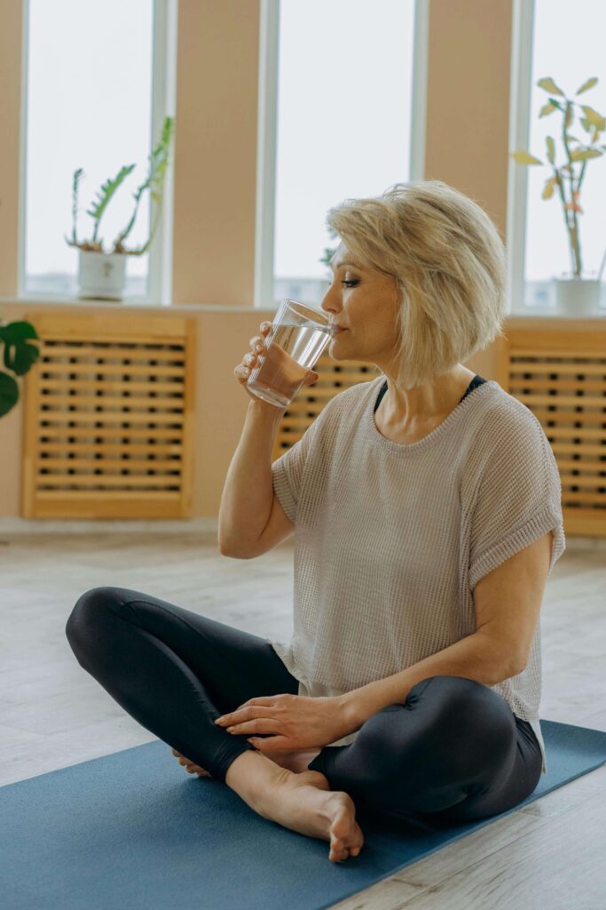 The Eye Wearhouse Olds woman drinking water skincare