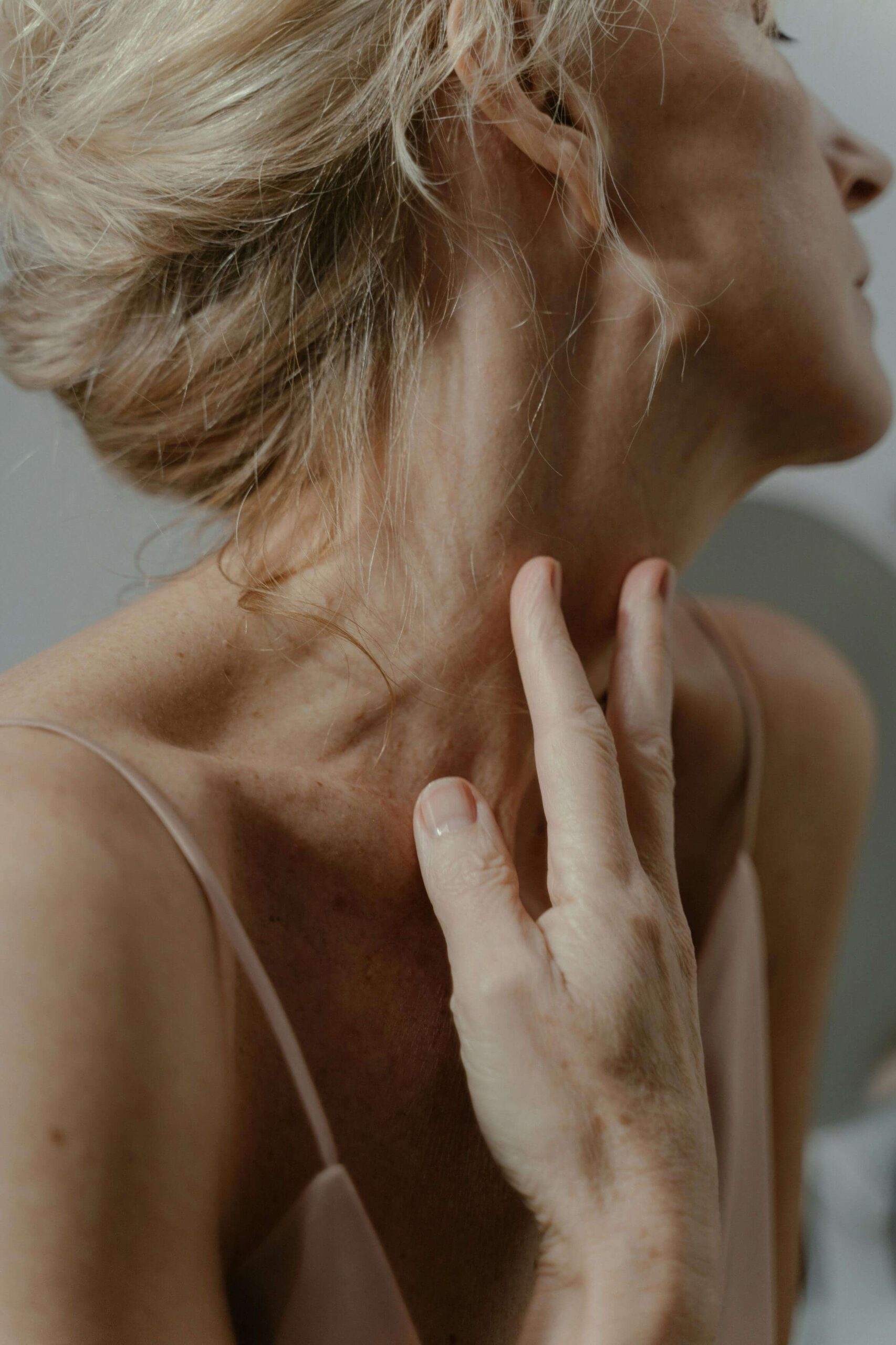 fine lines and wrinkles woman touching next the eye wearhouse
